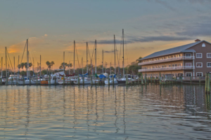 View of Cocoa Village Dentistry's office at the marina at Mariner Square with boats at the docks