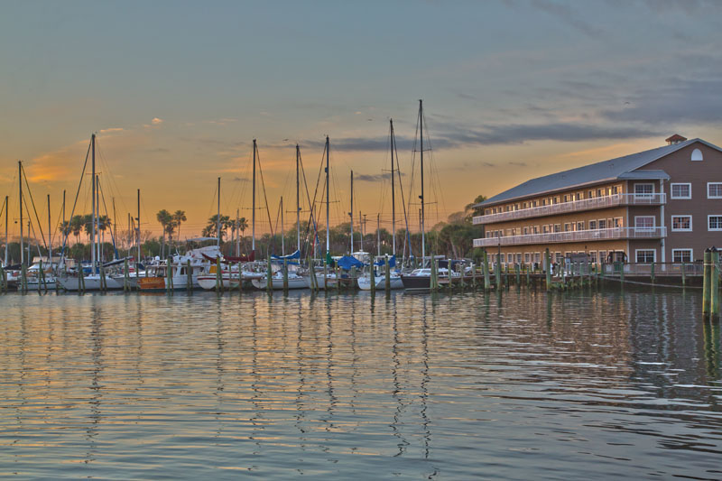 View of Cocoa Village Dentistry's office at the marina at Mariner Square with boats at the docks